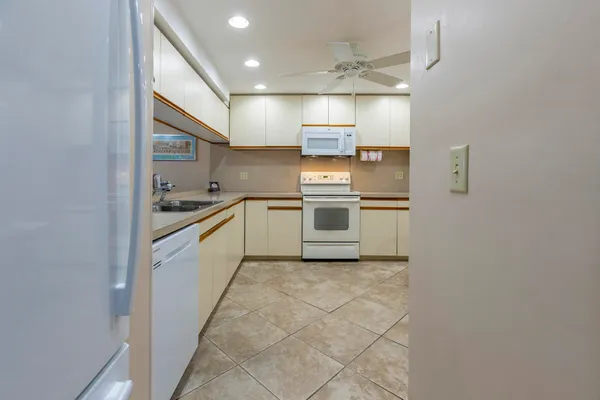 a kitchen with stainless steel appliances cabinets a sink and a stove