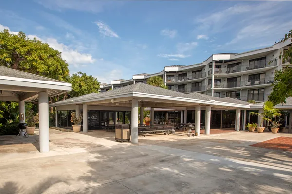 a view of a house with swimming pool and sitting area