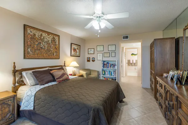 a bathroom with a sink a mirror and a shower