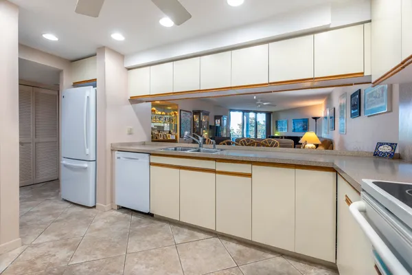 a kitchen with stainless steel appliances granite countertop a sink and cabinets