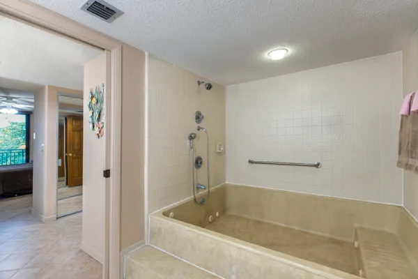 a view of a bathroom from a hallway