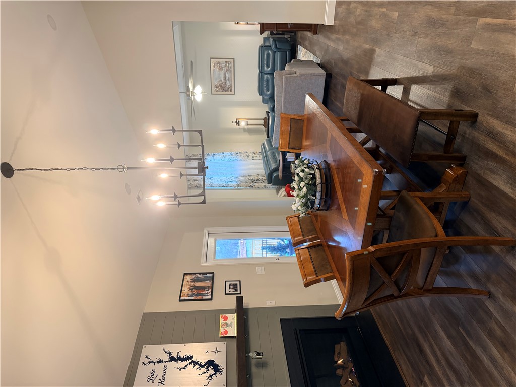 203 Legacy Lane Liberty, SC 29657 - Photo 12 of 47 This inviting dining area features elegant fixtures and rich flooring, ideal for gatherings.