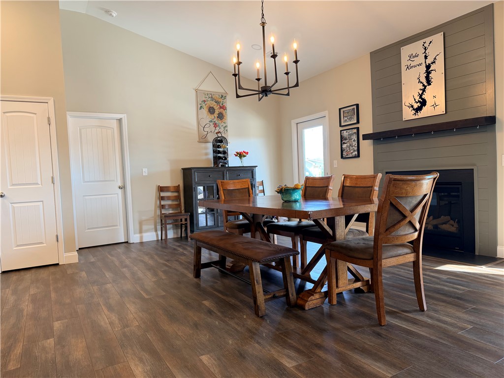 203 Legacy Lane Liberty, SC 29657 - Photo 13 of 47 This inviting dining area features high ceilings and a fireplace, creating a warm and spacious ambiance.