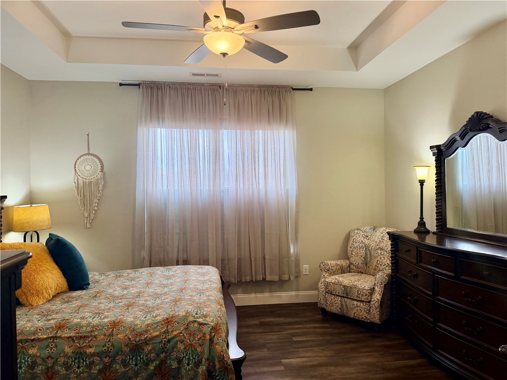 203 Legacy Lane Liberty, SC 29657 - Photo 17 of 47 This tranquil primarybedroom features elegant tray ceilings and rich wood flooring, ideal for peaceful repose.