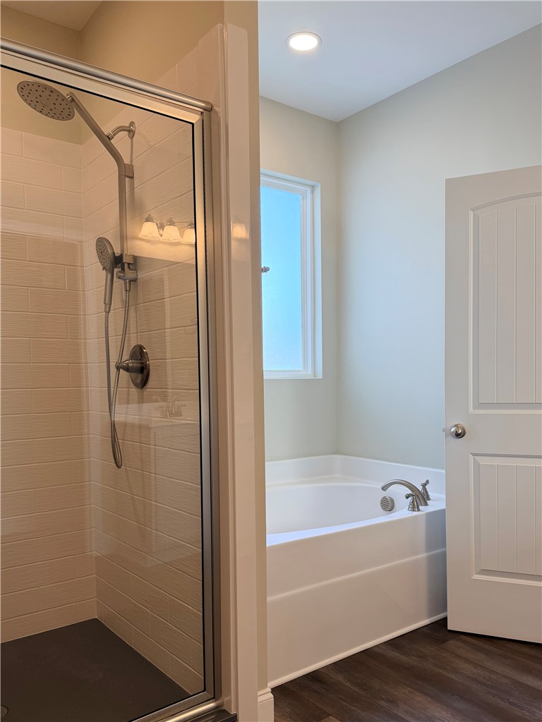203 Legacy Lane Liberty, SC 29657 - Photo 19 of 47 A well-appointed bathroom offers both a shower and a deep soaking tub for ultimate relaxation.