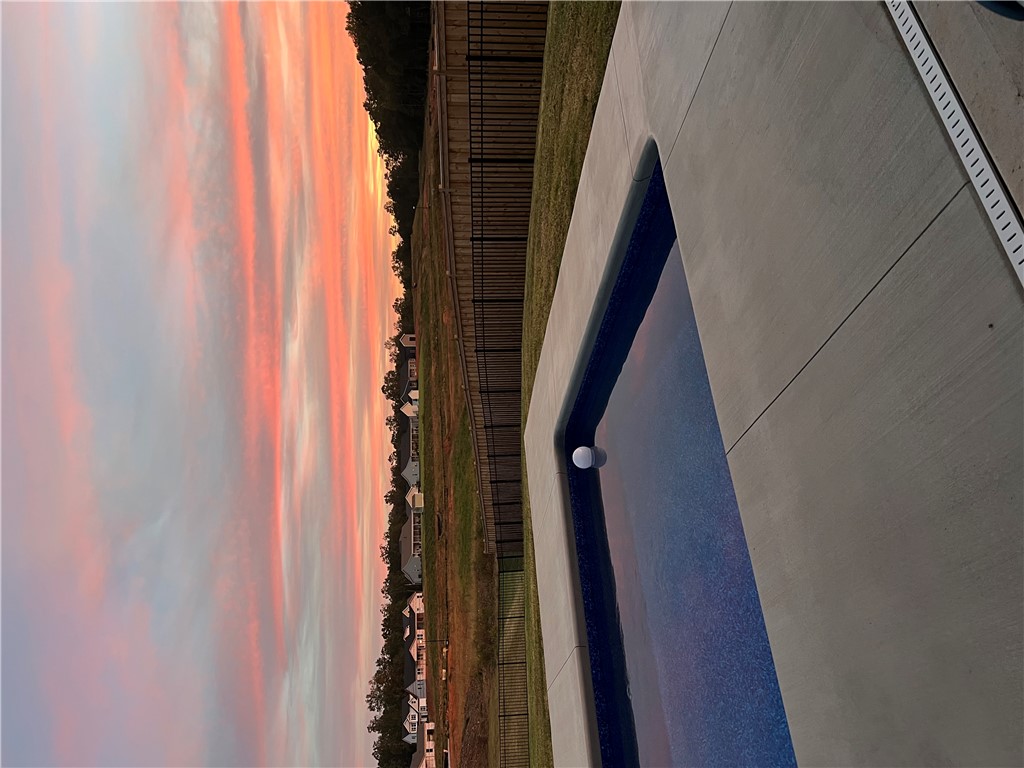 203 Legacy Lane Liberty, SC 29657 - Photo 2 of 47 This serene pool setting captures the essence of outdoor relaxation.