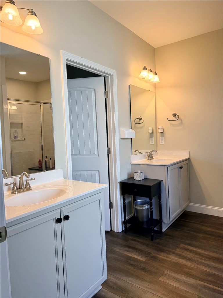 203 Legacy Lane Liberty, SC 29657 - Photo 21 of 47 This bathroom features dual vanities and modern wood-look flooring.