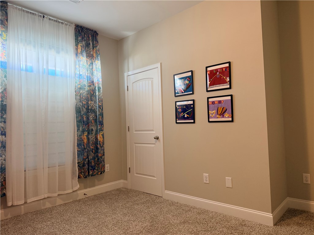 203 Legacy Lane Liberty, SC 29657 - Photo 24 of 47 This cozy bedroom features plush carpeting, elegant trim, and abundant natural light.