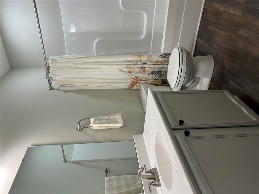 203 Legacy Lane Liberty, SC 29657 - Photo 25 of 47 This clean and functional bathroom offers essential amenities and a modern vanity.