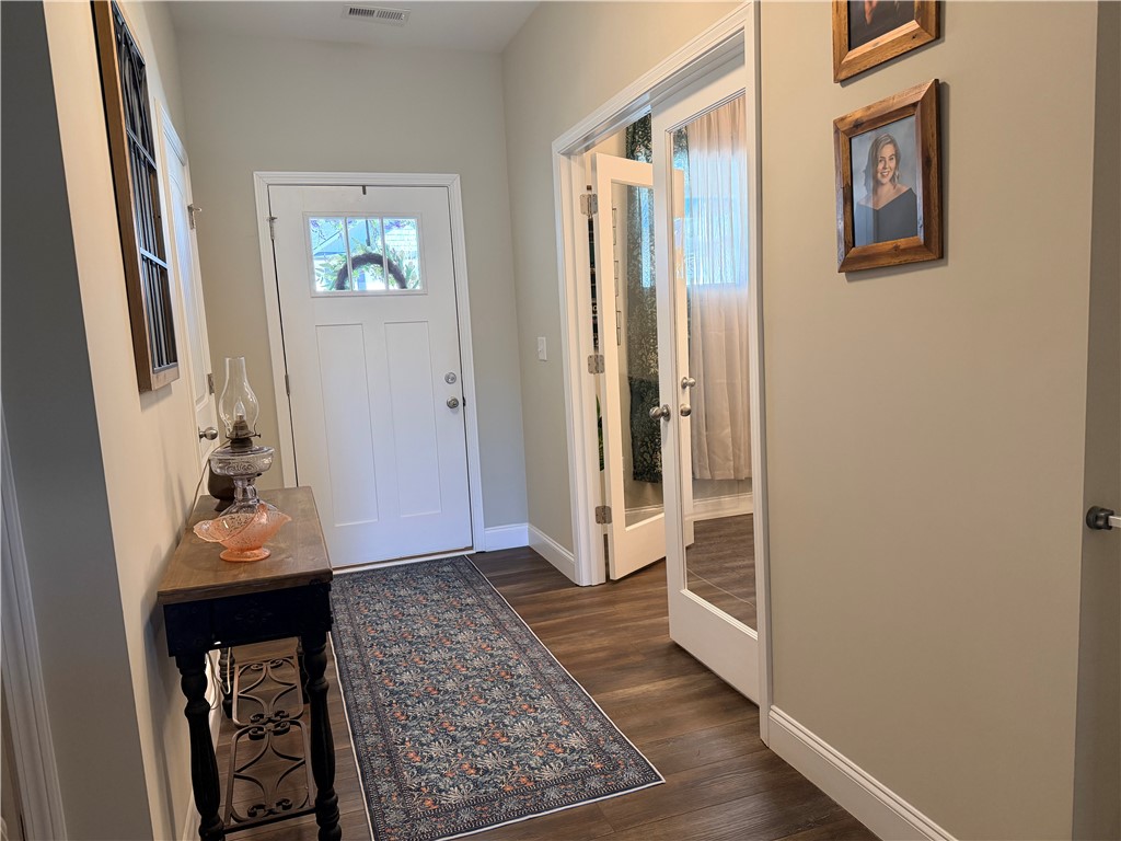 203 Legacy Lane Liberty, SC 29657 - Photo 30 of 47 This inviting entryway features rich wood flooring, leading guests into elegant interiors.