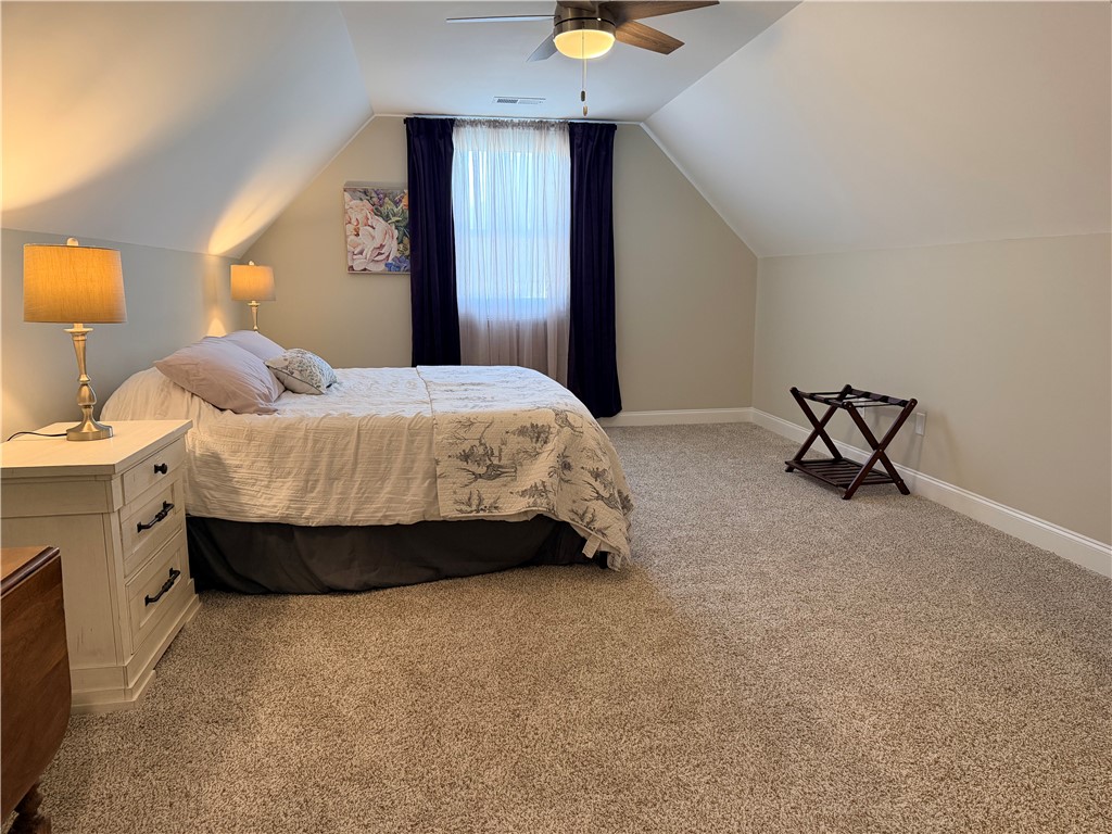 203 Legacy Lane Liberty, SC 29657 - Photo 31 of 47 This cozy bedroom features vaulted ceilings and plush carpet, creating a peaceful retreat.