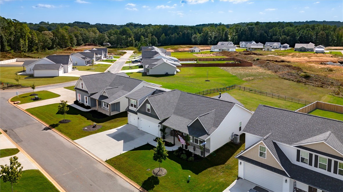 203 Legacy Lane Liberty, SC 29657 - Photo 39 of 47 An aerial perspective reveals a vibrant new neighborhood with meticulously landscaped lawns and varied home styles.