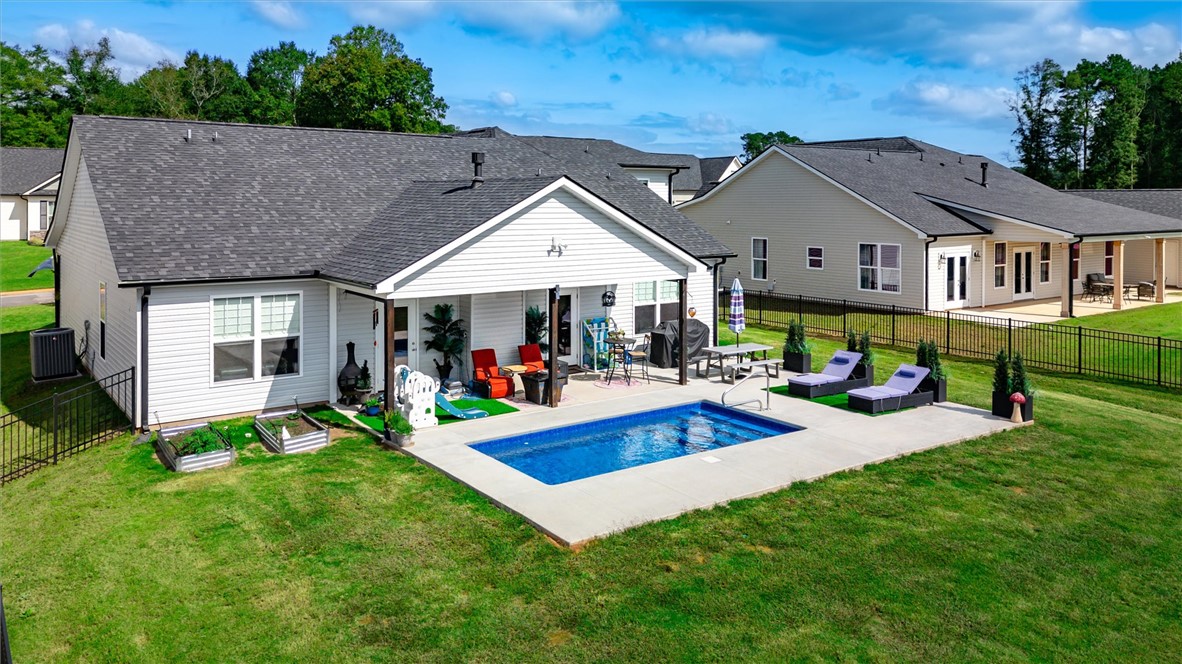 203 Legacy Lane Liberty, SC 29657 - Photo 40 of 47 This outdoor oasis features a private pool, a comfortable patio, and a well-maintained lawn.