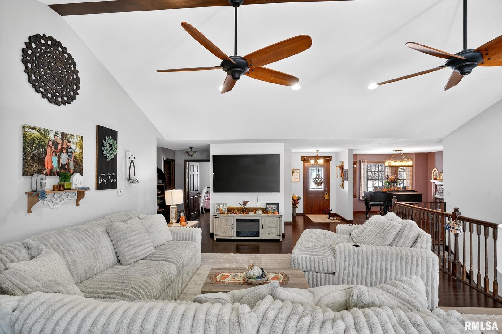 5759 Riverview Road Thomson, IL 61285 - Photo 14 of 49 a living room with furniture a fireplace and a flat screen tv