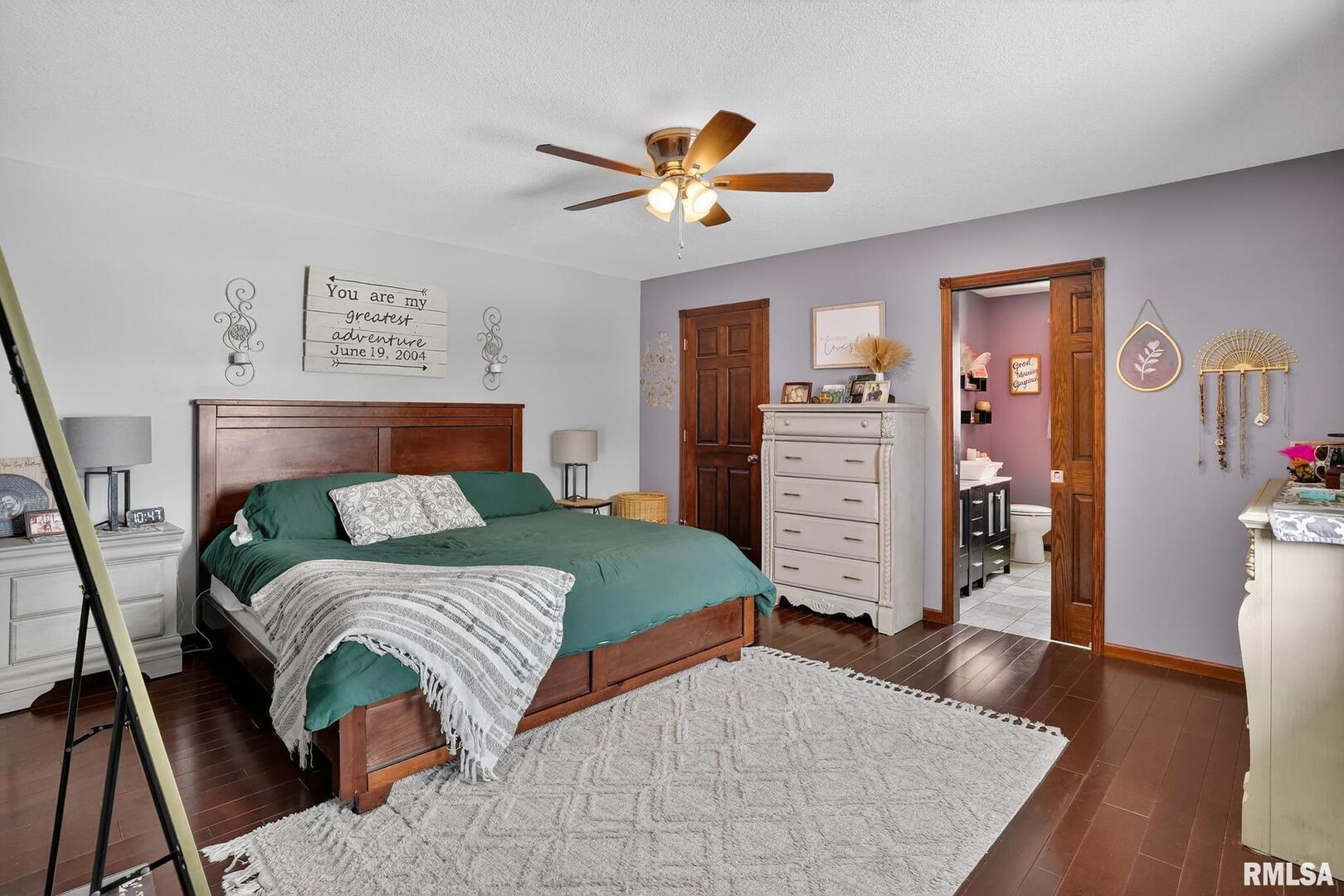 5759 Riverview Road Thomson, IL 61285 - Photo 24 of 49 a bedroom with a bed and a chandelier