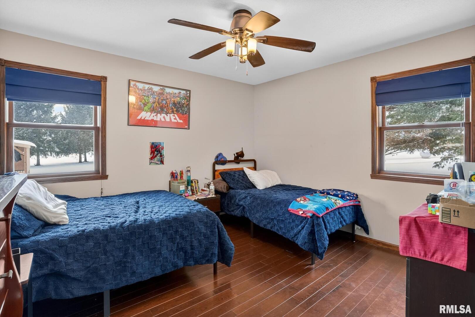 5759 Riverview Road Thomson, IL 61285 - Photo 34 of 49 a bedroom with two beds and a window