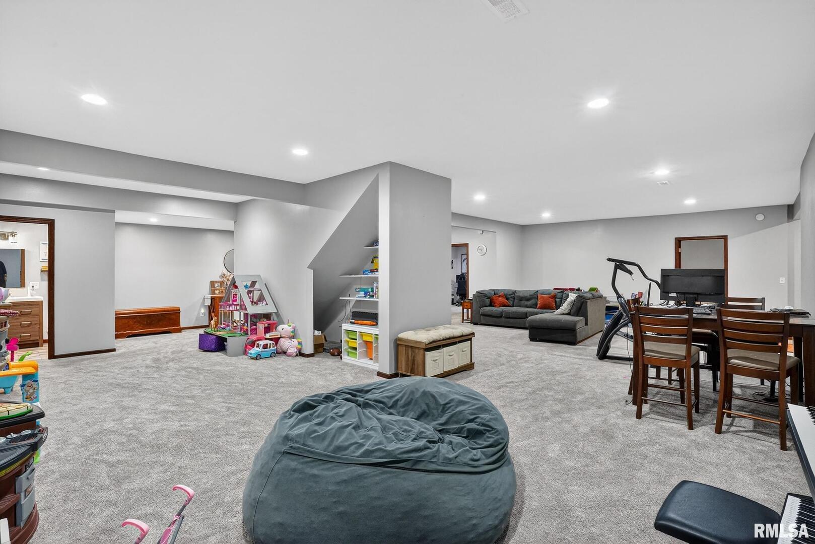 5759 Riverview Road Thomson, IL 61285 - Photo 45 of 49 a living room with furniture a gym equipment and a couch