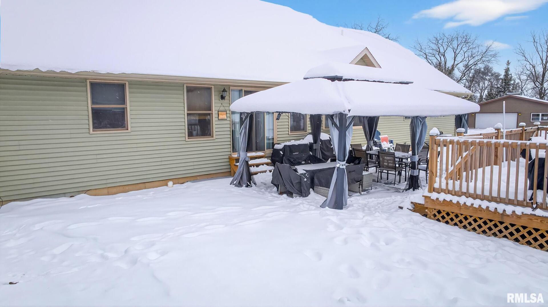 5759 Riverview Road Thomson, IL 61285 - Photo 6 of 49 a view of a patio with a patio and a yard