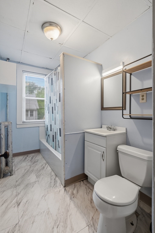 43 Elmdale Street, Unit 2 West Springfield, MA 01089 - Photo 14 of 14 a bathroom with a toilet sink and mirror