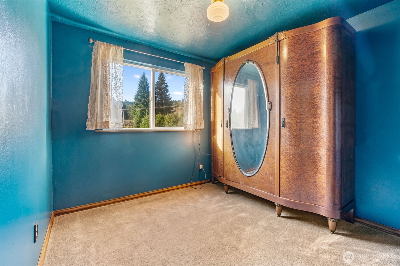 124 Highland Valley Road Morton, WA 98356 - Photo 15 of 36 a view of a livingroom with wooden floor and a window