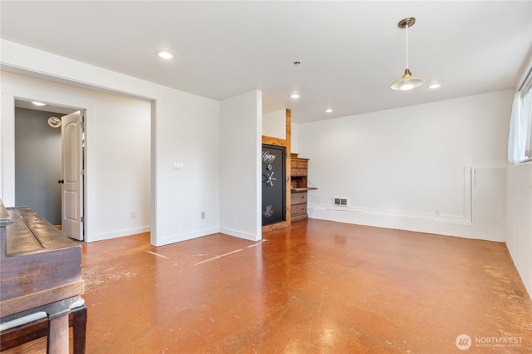 124 Highland Valley Road Morton, WA 98356 - Photo 17 of 36 a view of an empty room with wooden floor and a cabinet