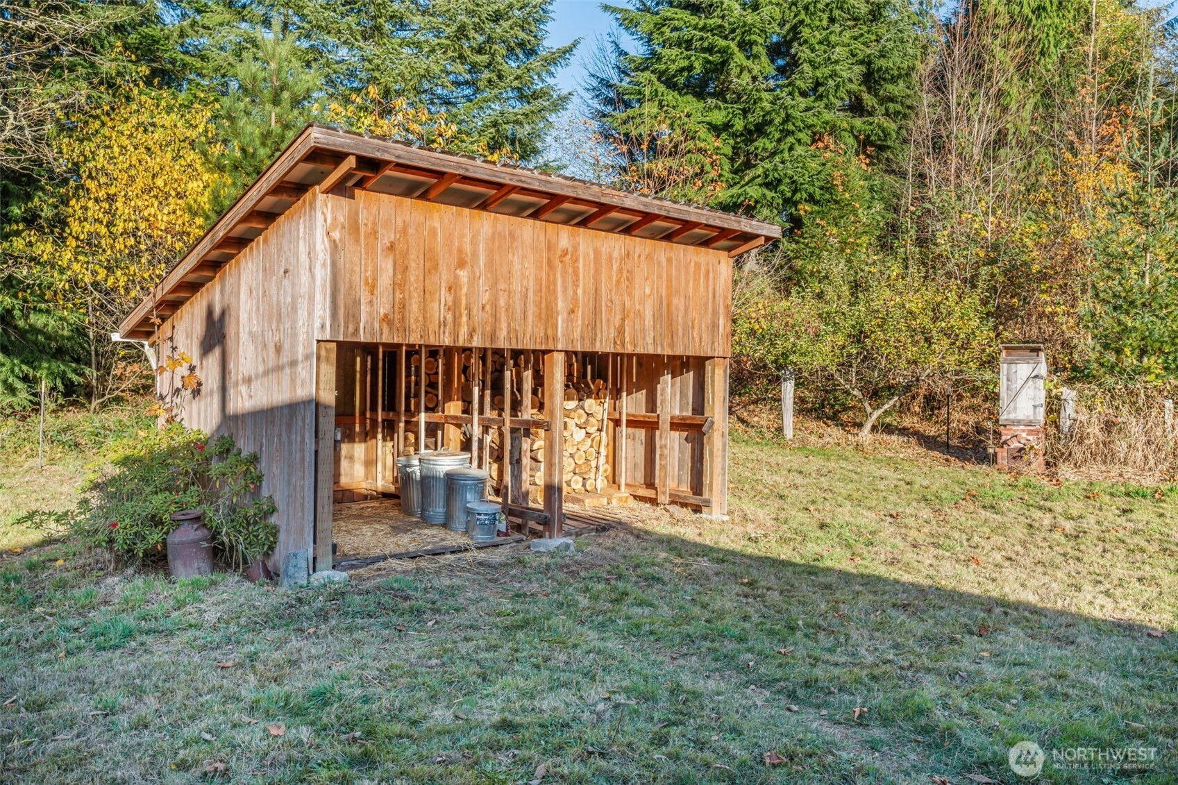 124 Highland Valley Road Morton, WA 98356 - Photo 26 of 36 a view of wooden house with a yard and large trees