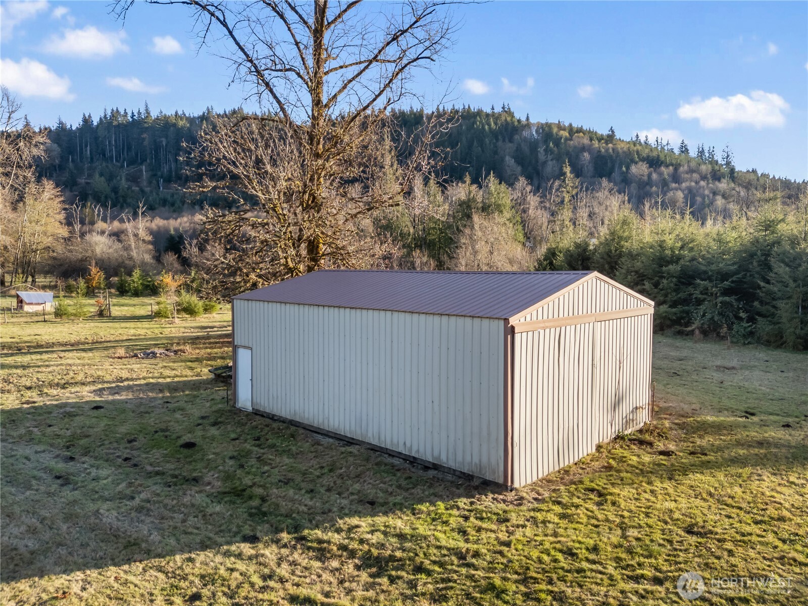 124 Highland Valley Road Morton, WA 98356 - Photo 28 of 36 a backyard of a house with lots of green space