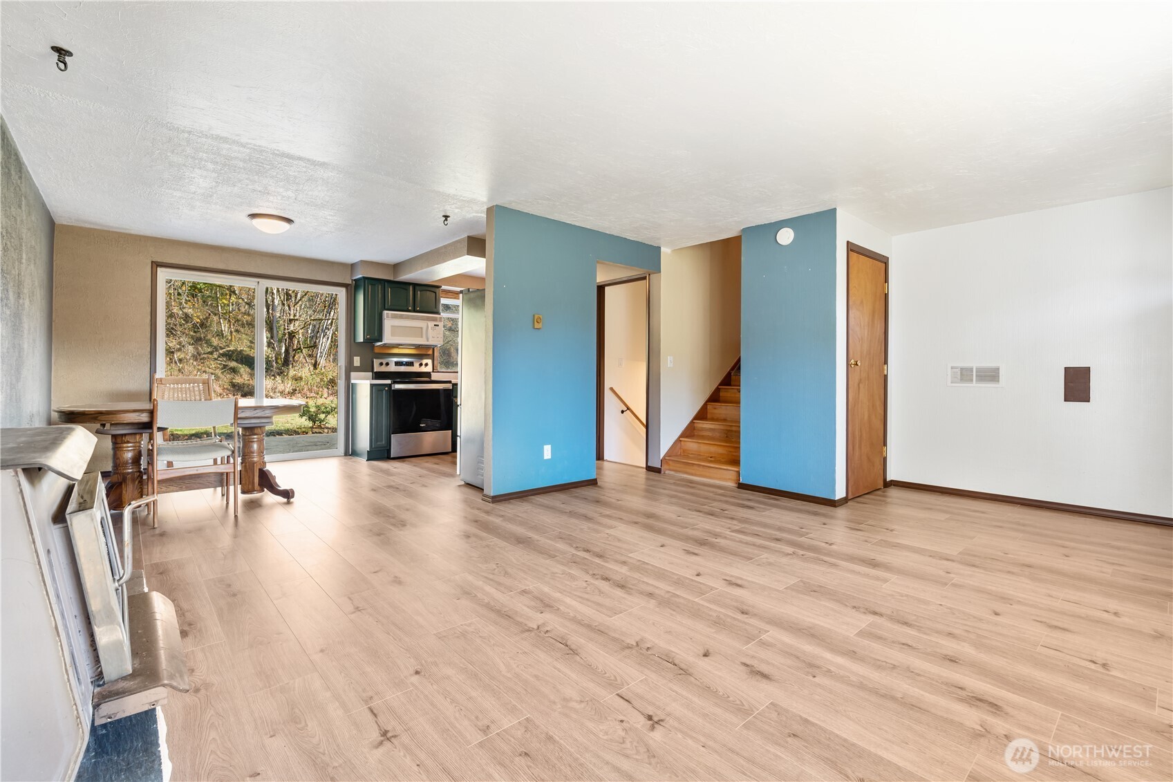 124 Highland Valley Road Morton, WA 98356 - Photo 6 of 36 a view of a livingroom with furniture hardwood floor and a ceiling fan