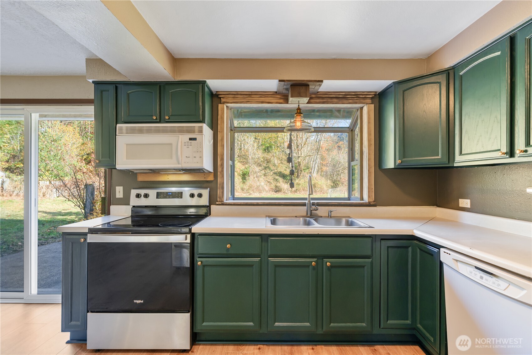 124 Highland Valley Road Morton, WA 98356 - Photo 8 of 36 a kitchen with a sink stove and microwave