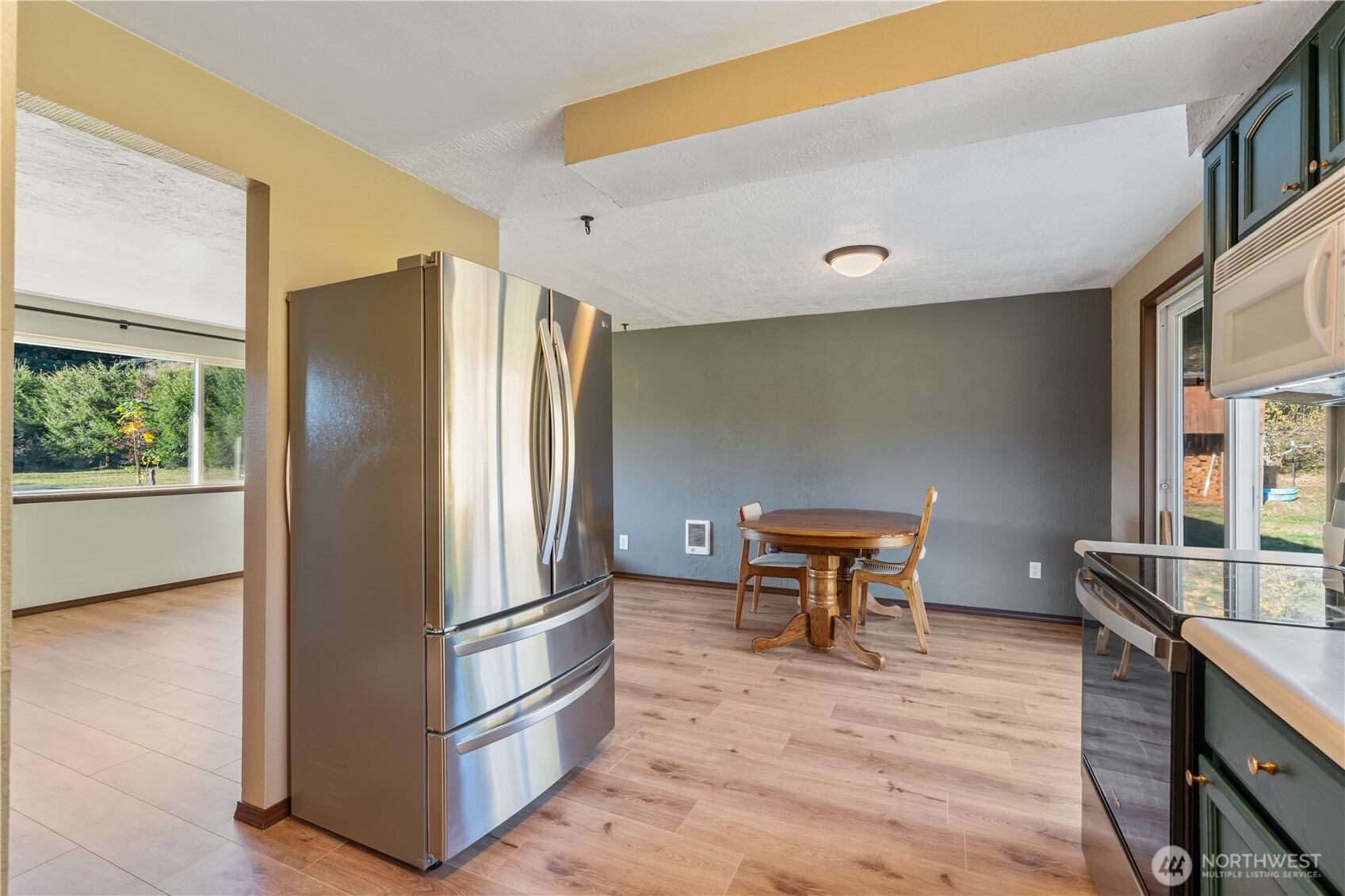 124 Highland Valley Road Morton, WA 98356 - Photo 10 of 36 a kitchen with stainless steel appliances granite countertop a refrigerator and a stove top oven