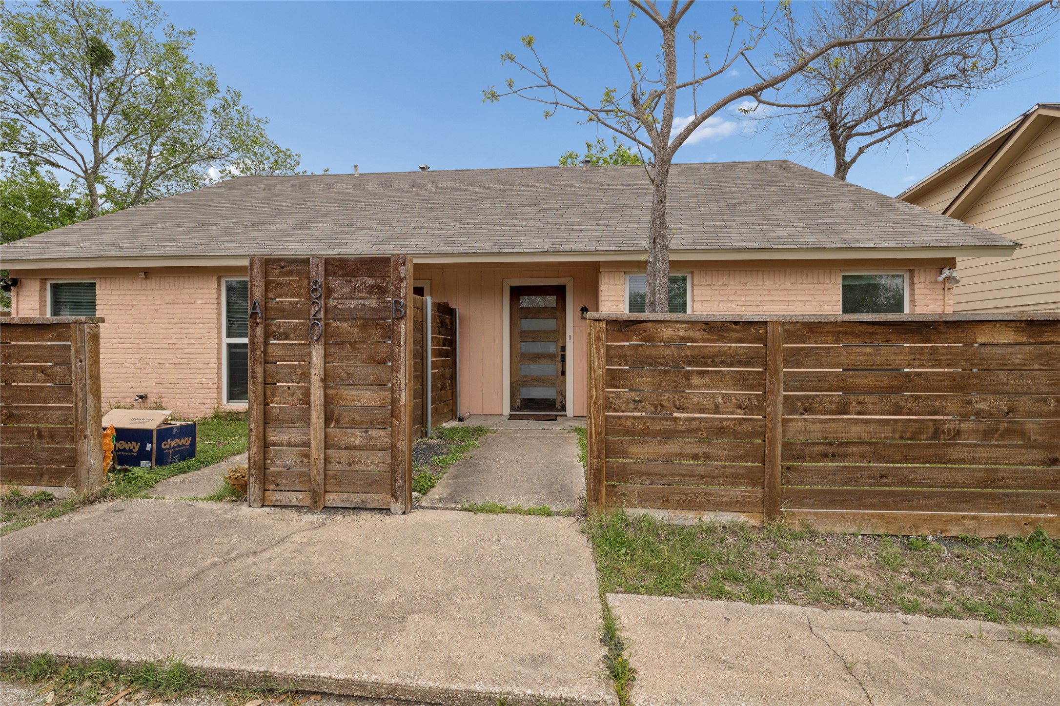 820 Sahara Avenue, Unit B Austin, TX 78745 - Photo 1 of 29 View of front of house with roof with shingles and brick siding