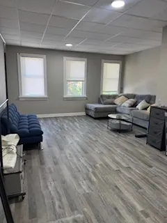 a living room with furniture and a window