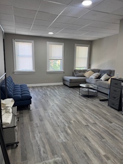 34 North Genesee Street Waukegan, IL 60085 - Photo 14 of 15 a living room with furniture and a window
