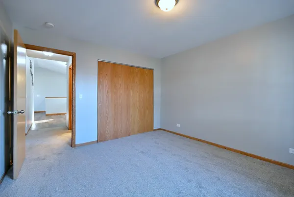 an empty room with a bathroom