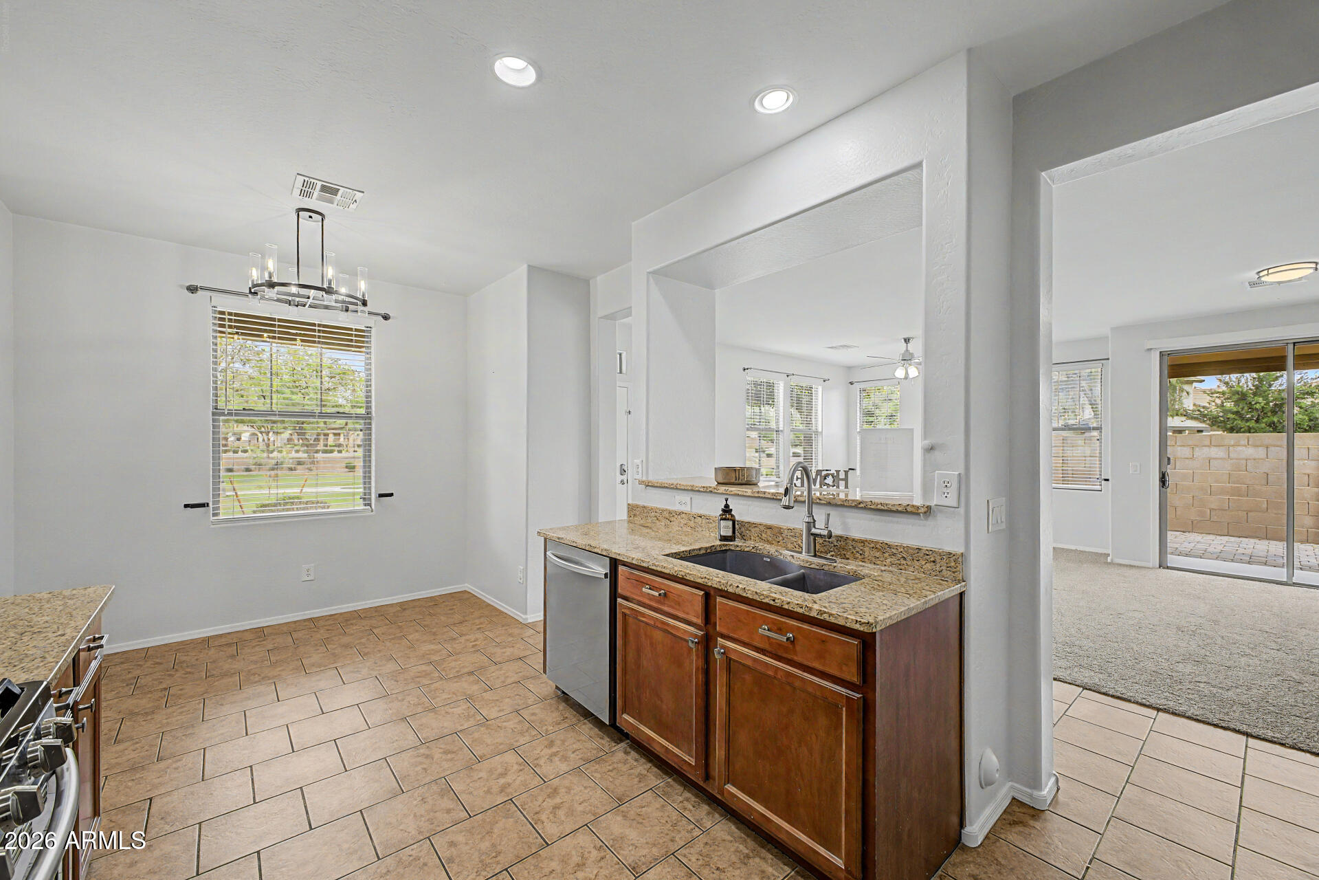 2868 South Anderson Lane Gilbert, AZ 85295 - Photo 16 of 59 a kitchen with a stove and a sink