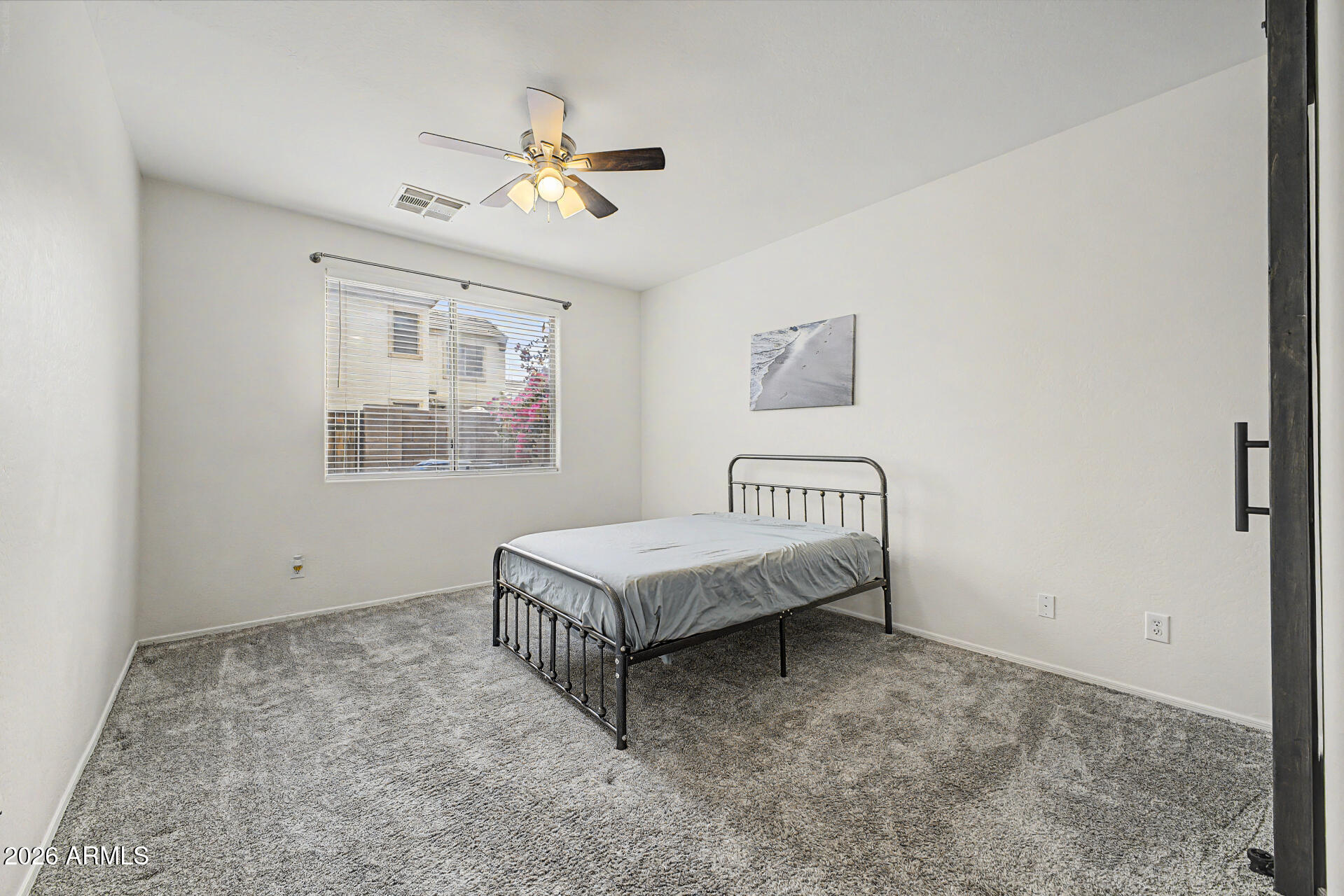 2868 South Anderson Lane Gilbert, AZ 85295 - Photo 17 of 59 a spacious bedroom with a bed and a window