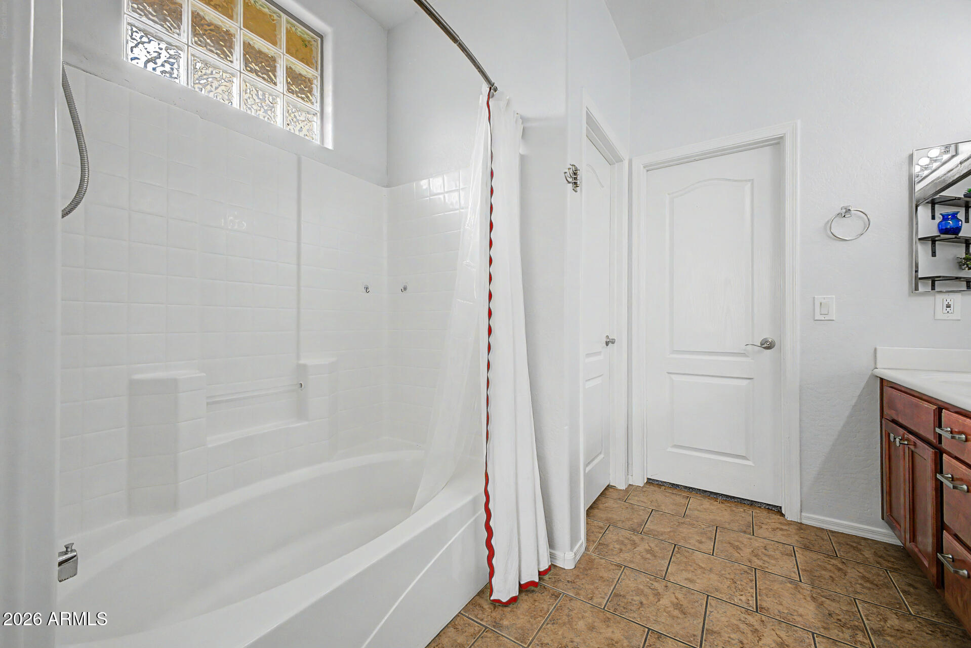2868 South Anderson Lane Gilbert, AZ 85295 - Photo 20 of 59 a bathroom with a bathtub and shower