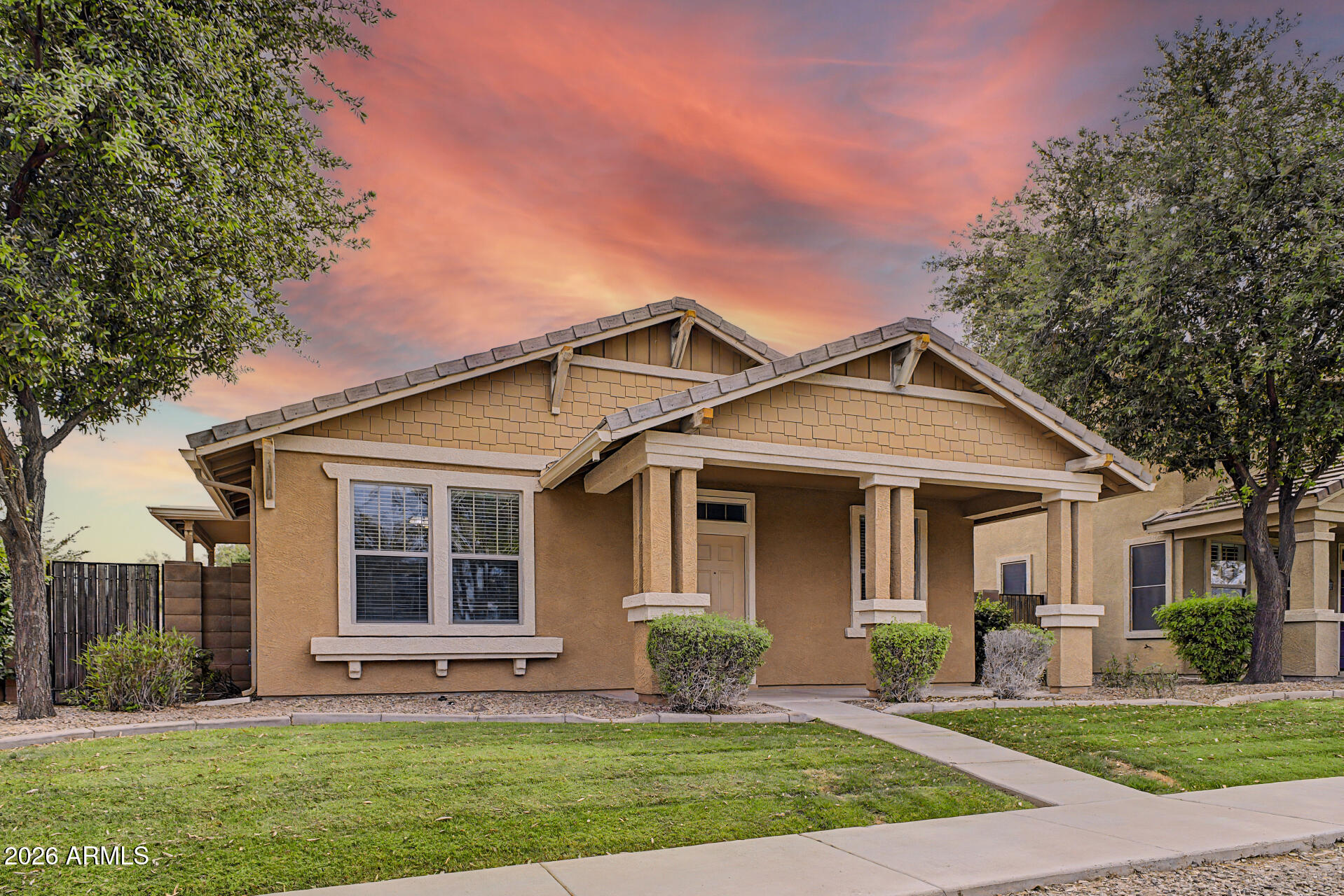 2868 South Anderson Lane Gilbert, AZ 85295 - Photo 2 of 59 a front view of a house with a yard and garage