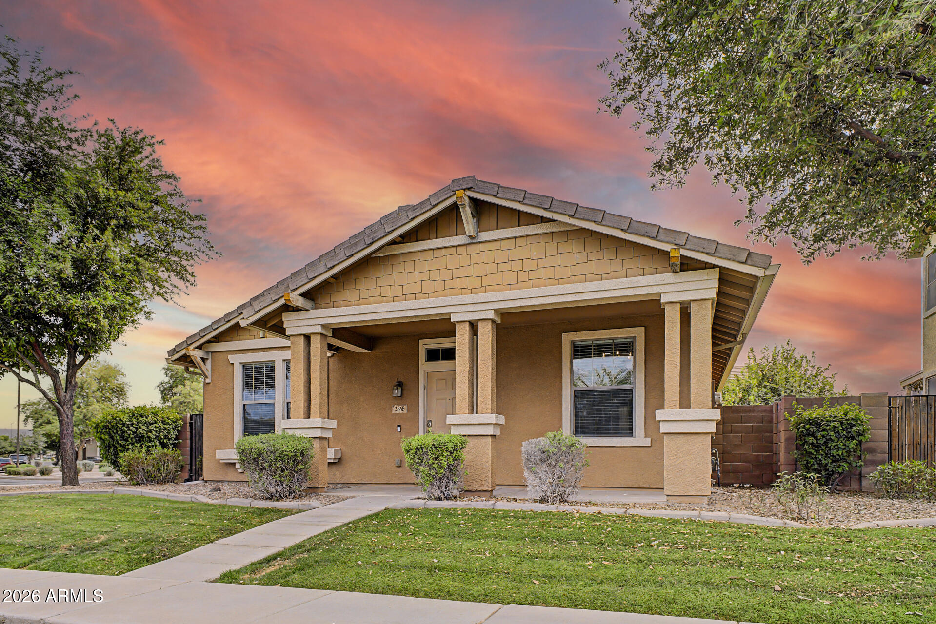 2868 South Anderson Lane Gilbert, AZ 85295 - Photo 3 of 59 a front view of a house with a yard