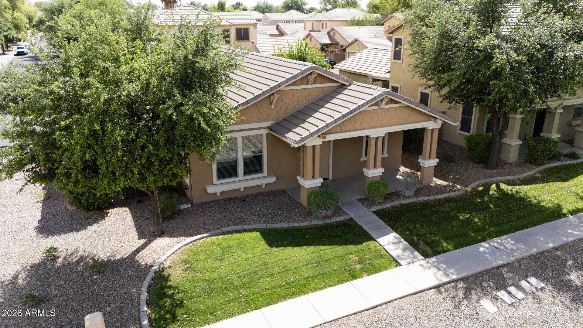 2868 South Anderson Lane Gilbert, AZ 85295 - Photo 43 of 59 a front view of a house with a yard
