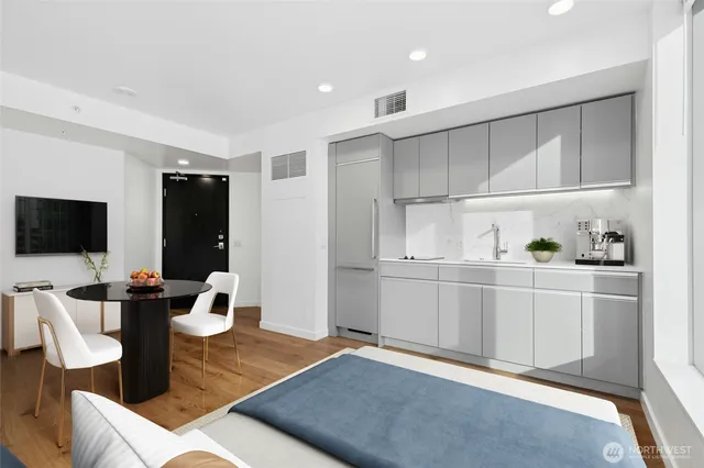 a view of kitchen with cabinets