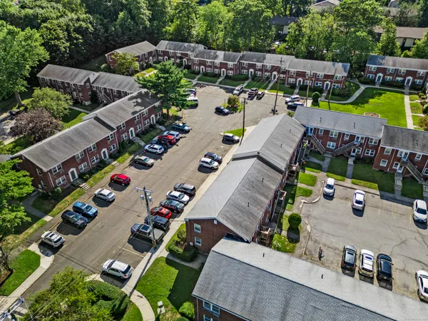 an aerial view of a house with yard swimming pool and outdoor seating