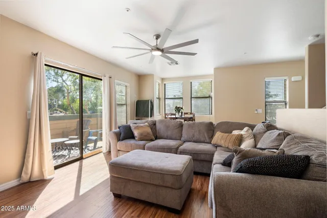 a living room with furniture and a large window