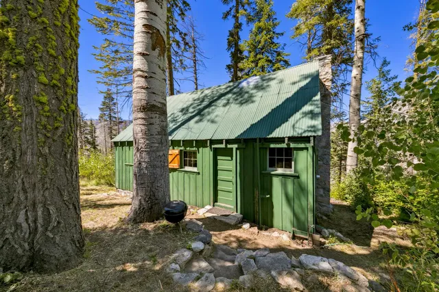 a view of a house with a small yard