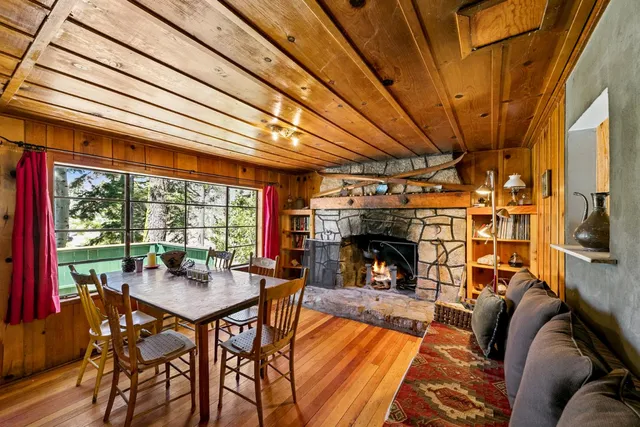 a view of a porch with furniture and a yard