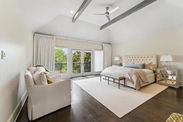 a spacious bedroom with a bed and a fireplace