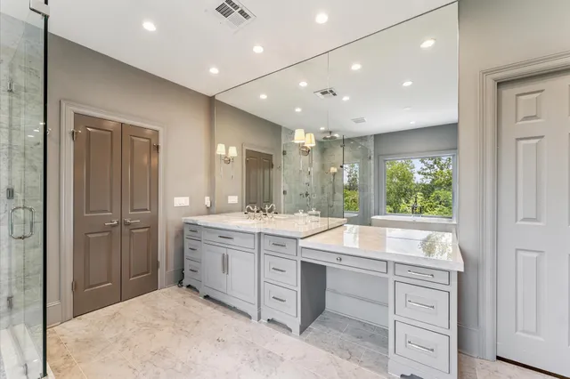 a bedroom with a bed and cabinet