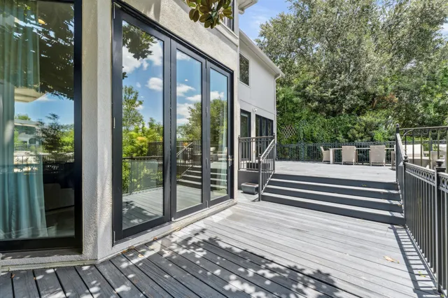 a wooden floor with a table and chairs
