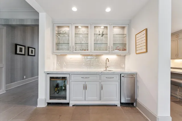 a kitchen with granite countertop a sink and a window