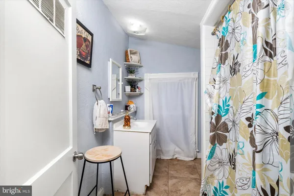 a room with a table and chairs in it